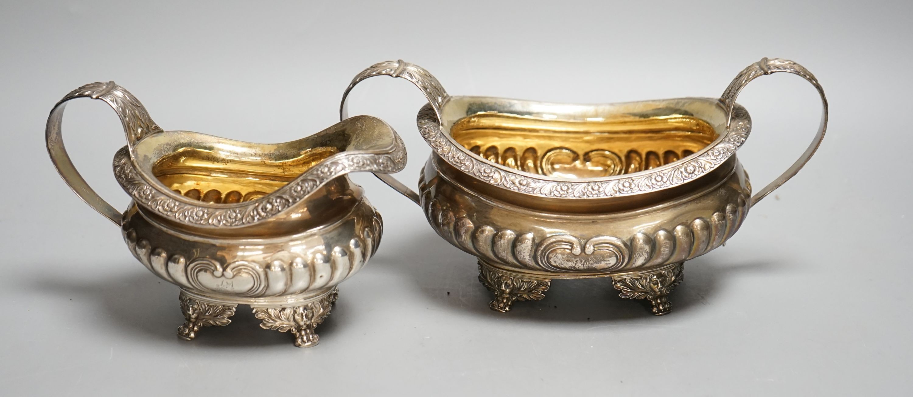 A late George III silver sugar bowl and cream jug, Robert Smeaton, Edinburgh, 1819, gross 19oz.
